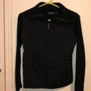 Black zip up jacket. No hood